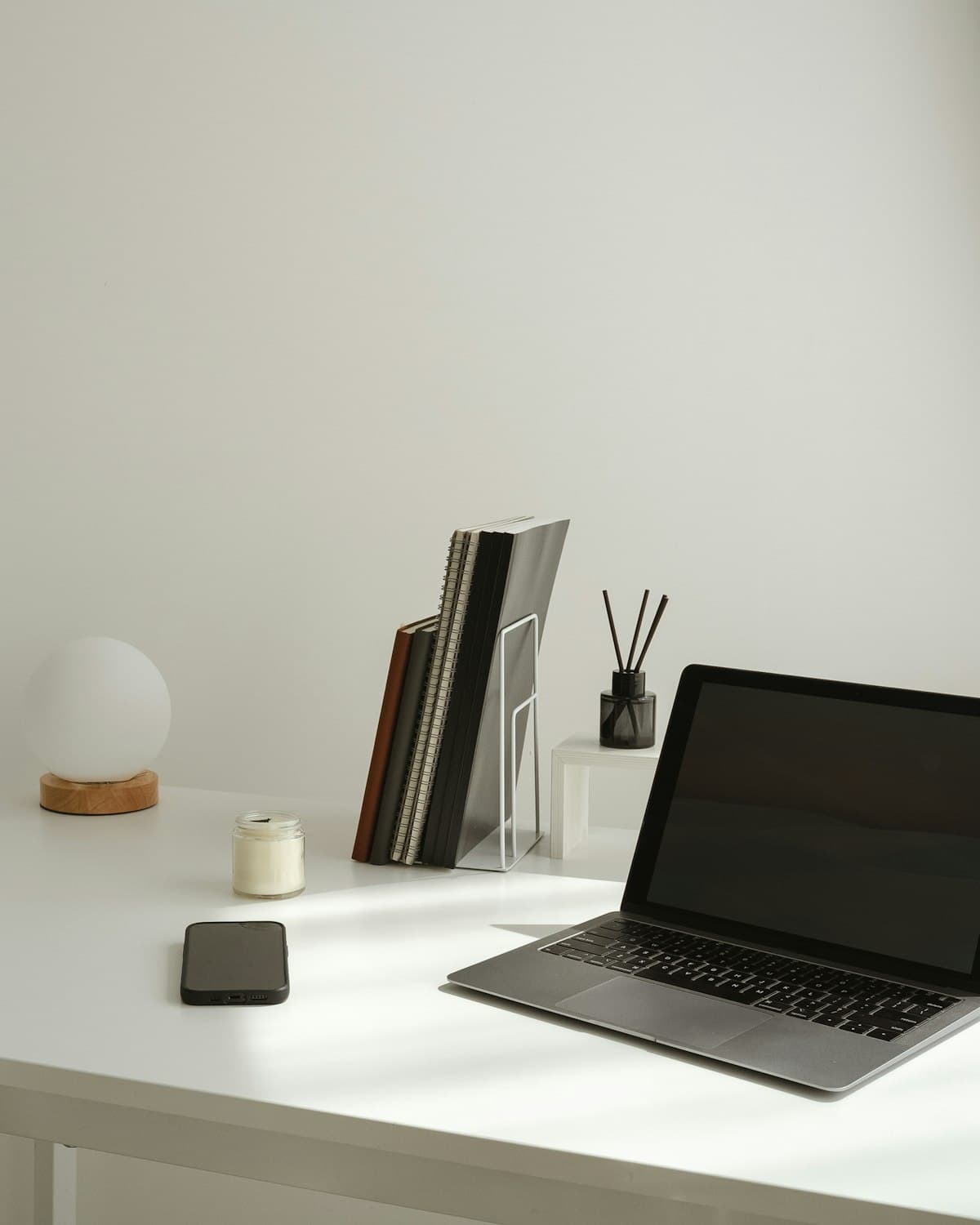 A calm, tidy modern desk with a laptop