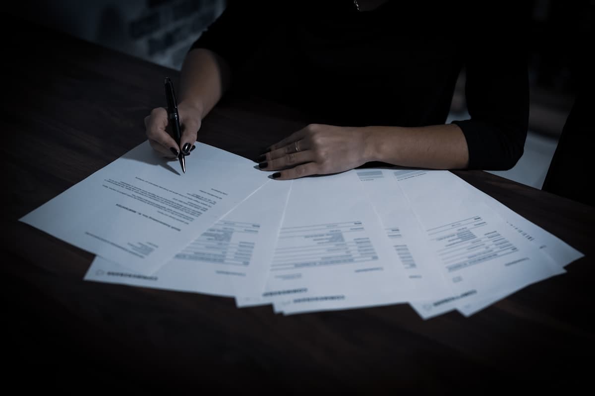 An overdue payment notice and paperwork on a desk