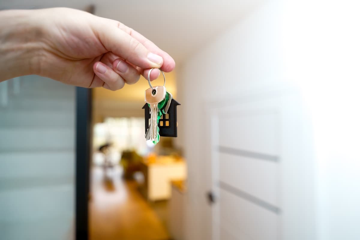 House keys resting on a signed contract